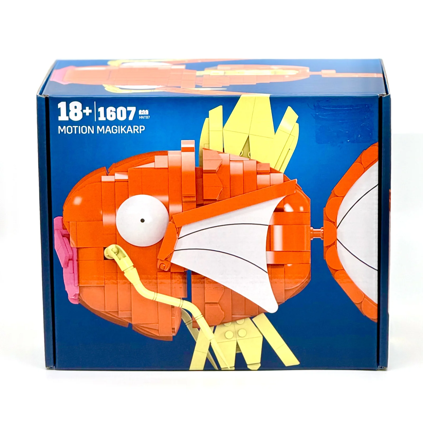 MEGA Pokémon Motion Magikarp brick-built display model packaging, showing the assembled Magikarp model with articulated fins, 1,607 pieces, recommended for ages 18 and up